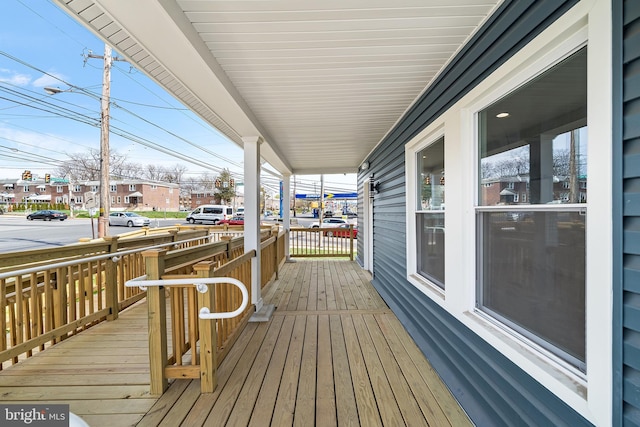 deck featuring a residential view and a porch
