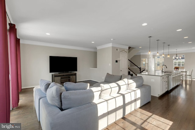 living area featuring recessed lighting, stairs, dark wood-style flooring, and ornamental molding