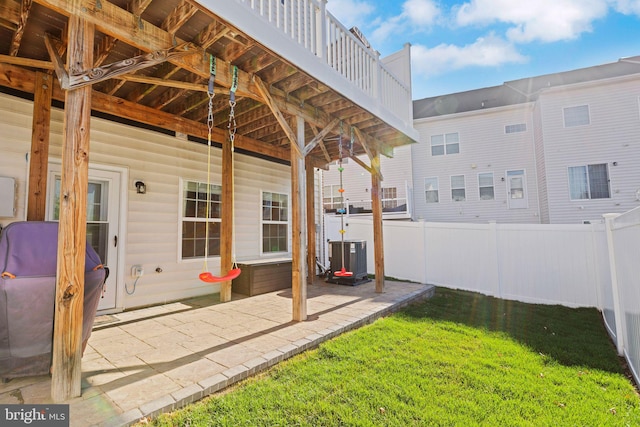view of patio featuring fence and central AC unit