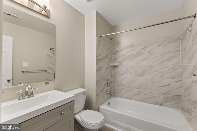 full bath with visible vents, toilet, shower / bath combination, and vanity
