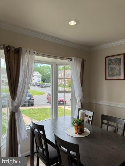 8659 Point Of Woods Dr, Manassas, VA 20110 - dining space with plenty of natural light and crown molding