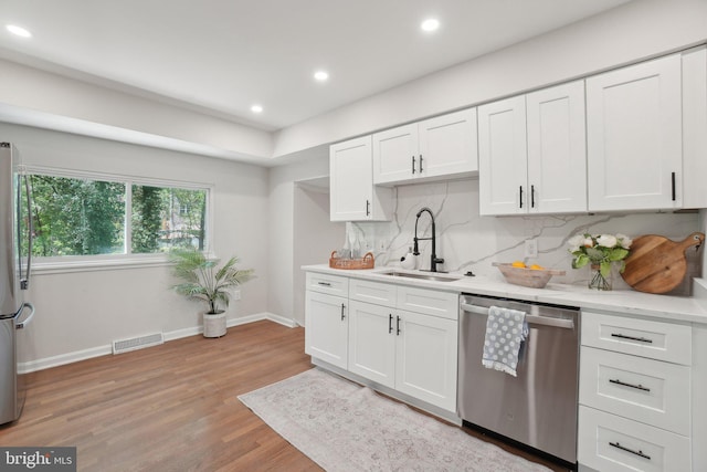 908 Queens Ter, Fort Washington, MD 20744 - kitchen with a sink, visible vents, light wood-style floors, light countertops, and appliances with stainless steel finishes