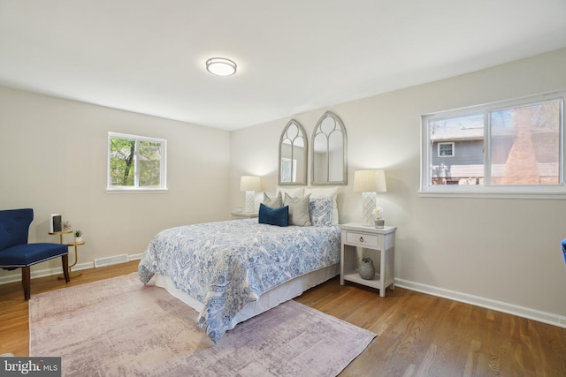 908 Queens Ter, Fort Washington, MD 20744 - bedroom featuring baseboards, wood finished floors, and visible vents