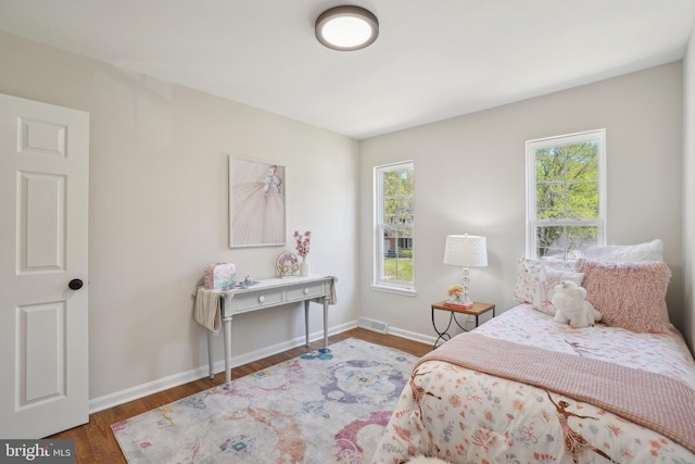 908 Queens Ter, Fort Washington, MD 20744 - bedroom with visible vents, baseboards, wood finished floors, and multiple windows