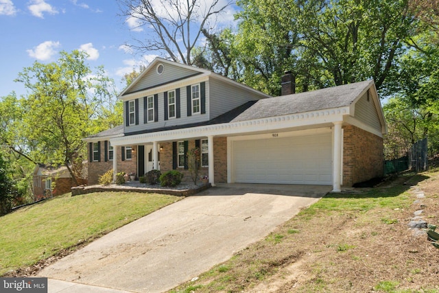 908 Queens Ter, Fort Washington, MD 20744 - view of front of property with concrete driveway, a front lawn, a porch, a garage, and brick siding