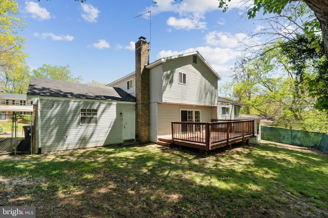 908 Queens Ter, Fort Washington, MD 20744 - back of house with fence, a lawn, a chimney, and a wooden deck