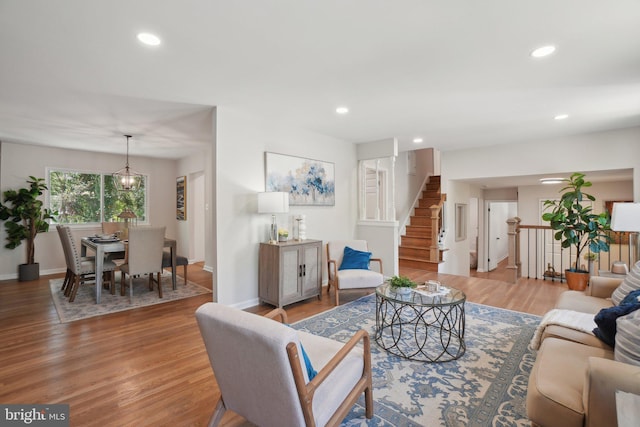 908 Queens Ter, Fort Washington, MD 20744 - living area featuring light wood-style flooring, baseboards, recessed lighting, and stairway