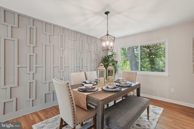 908 Queens Ter, Fort Washington, MD 20744 - dining room with light wood-type flooring, baseboards, and a chandelier
