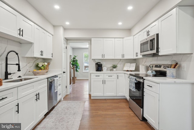 908 Queens Ter, Fort Washington, MD 20744 - kitchen with stainless steel appliances, a sink, recessed lighting, and tasteful backsplash