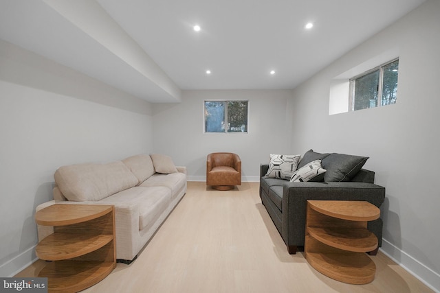 living room with baseboards, recessed lighting, and wood finished floors
