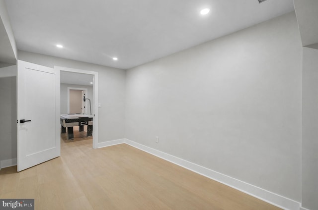 interior space with light wood-style flooring, recessed lighting, and baseboards