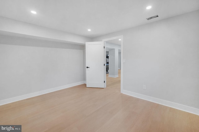 unfurnished room featuring visible vents, baseboards, light wood finished floors, and recessed lighting