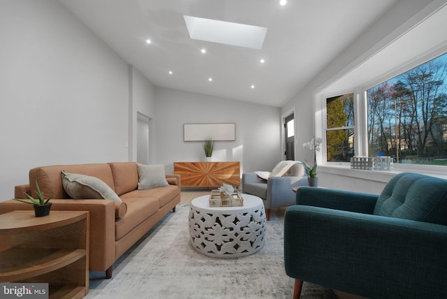 living room with recessed lighting, lofted ceiling with skylight, and wood finished floors