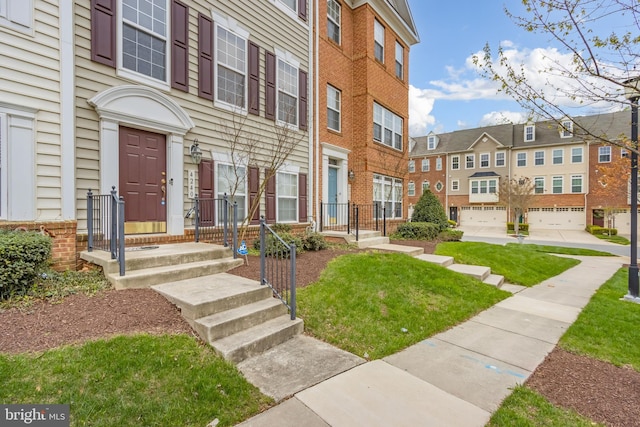 entrance to property featuring brick siding and a residential view