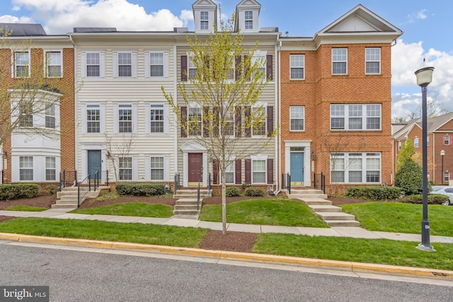 multi unit property featuring brick siding