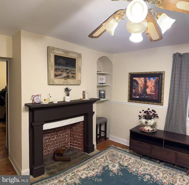 9056 Baltimore St, Savage, MD 20763 - living room featuring built in shelves, baseboards, and wood finished floors