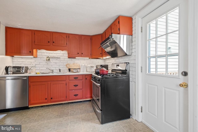9056 Baltimore St, Savage, MD 20763 - kitchen with light countertops, backsplash, extractor fan, stainless steel appliances, and a sink