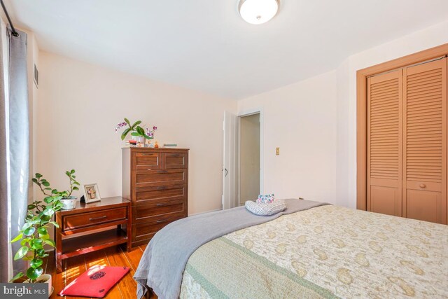 9056 Baltimore St, Savage, MD 20763 - bedroom featuring a closet and wood finished floors