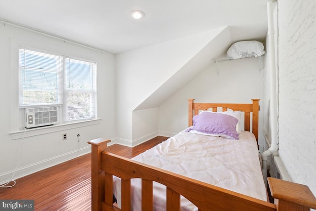 9056 Baltimore St, Savage, MD 20763 - bedroom featuring cooling unit, baseboards, and wood finished floors
