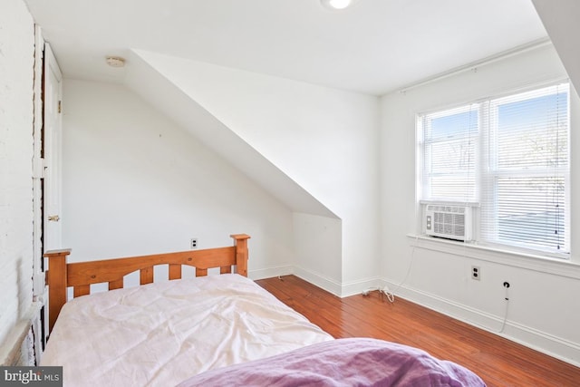 9056 Baltimore St, Savage, MD 20763 - bedroom featuring lofted ceiling, cooling unit, baseboards, and wood finished floors