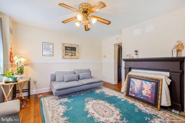 9056 Baltimore St, Savage, MD 20763 - living area with visible vents, ceiling fan, wood finished floors, and baseboards