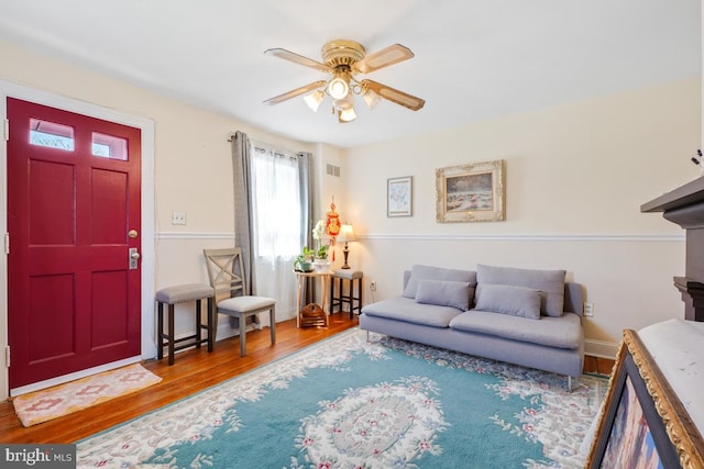 9056 Baltimore St, Savage, MD 20763 - living area featuring a ceiling fan and wood finished floors