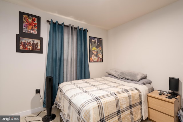 carpeted bedroom with baseboards