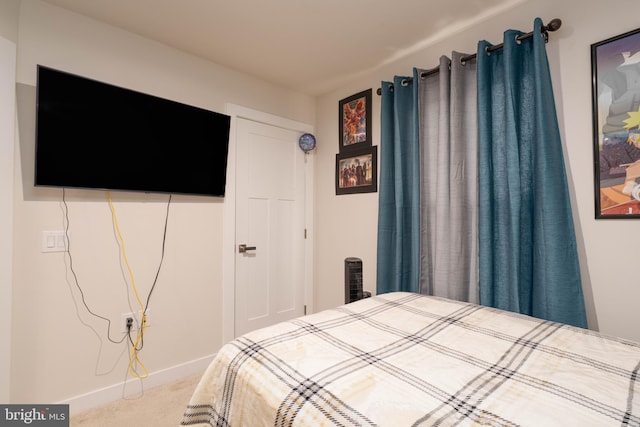 bedroom featuring baseboards and carpet flooring