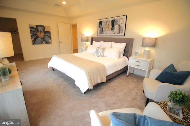 carpeted bedroom featuring visible vents, recessed lighting, baseboards, and a tray ceiling