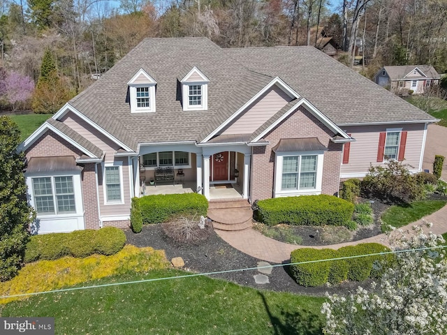 view of front of house with roof with shingles