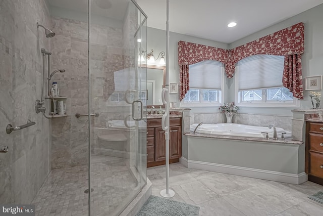 bathroom featuring recessed lighting, a garden tub, vanity, and a stall shower