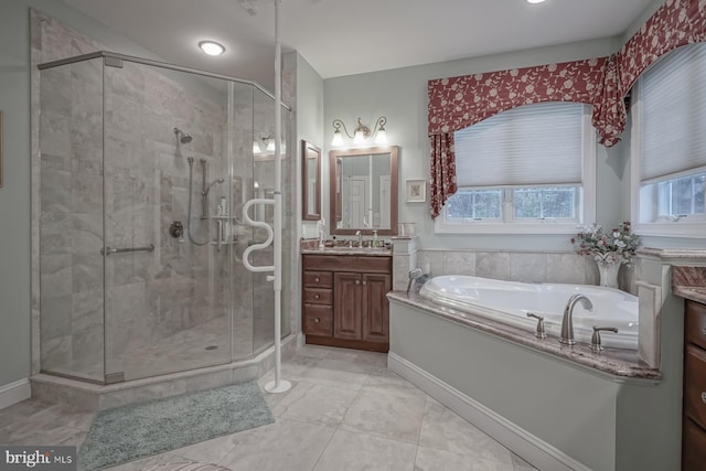 full bathroom with a bath, baseboards, vanity, and a shower stall