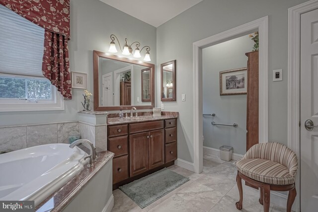 full bathroom featuring a garden tub and vanity