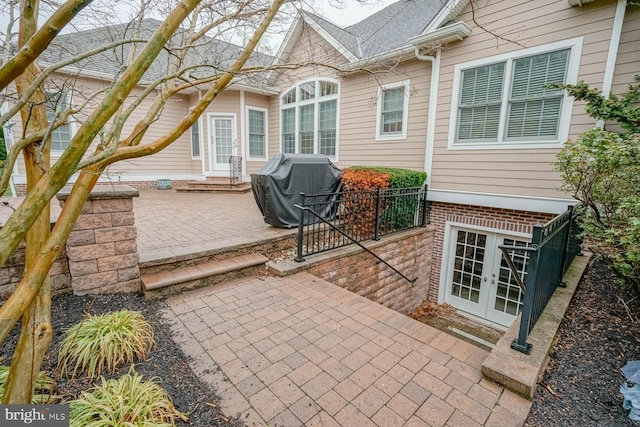view of patio with a grill and french doors