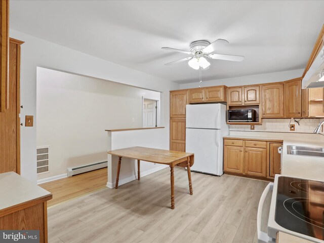449 Fairview Cir, Woodstock, VA 22664 - kitchen with a baseboard radiator, ceiling fan, white appliances, and light wood-type flooring