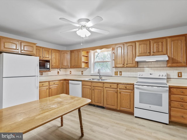 449 Fairview Cir, Woodstock, VA 22664 - kitchen with a sink, tasteful backsplash, white appliances, light countertops, and under cabinet range hood