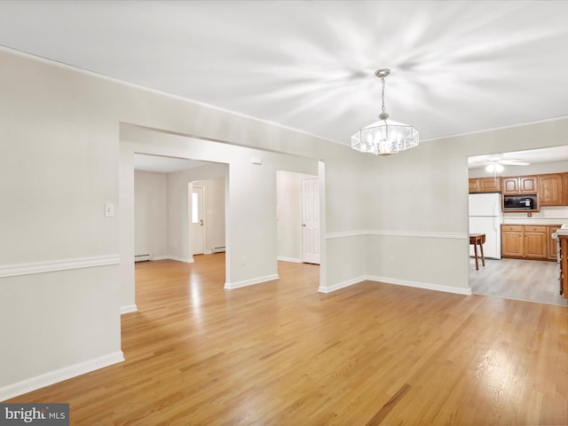 449 Fairview Cir, Woodstock, VA 22664 - unfurnished dining area featuring light wood-style flooring, baseboards, and a baseboard radiator