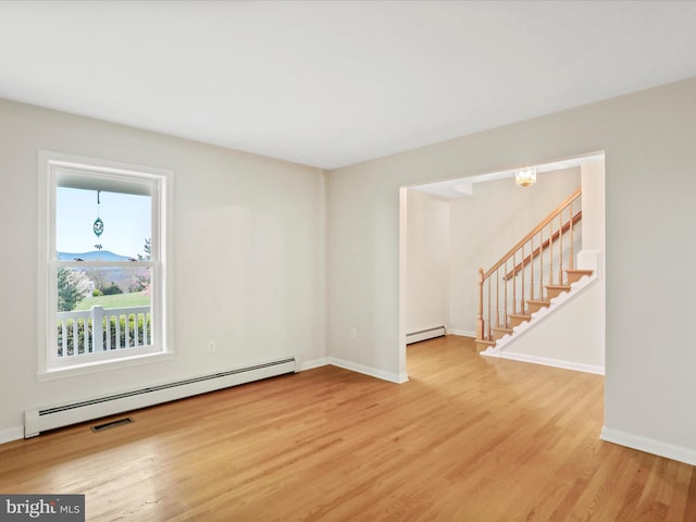 449 Fairview Cir, Woodstock, VA 22664 - unfurnished room featuring light wood finished floors, baseboard heating, baseboards, and visible vents