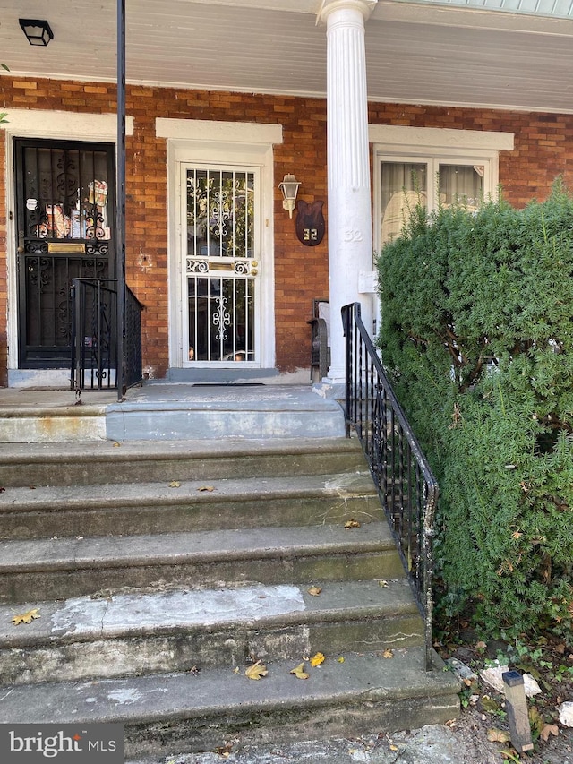 doorway to property with a porch