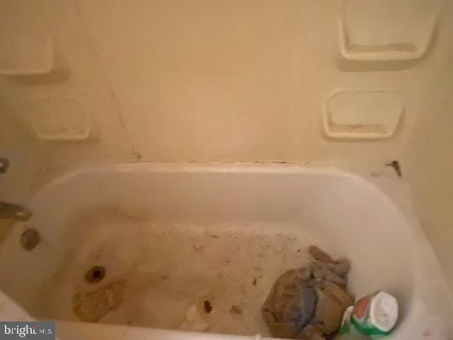 full bathroom with a tub