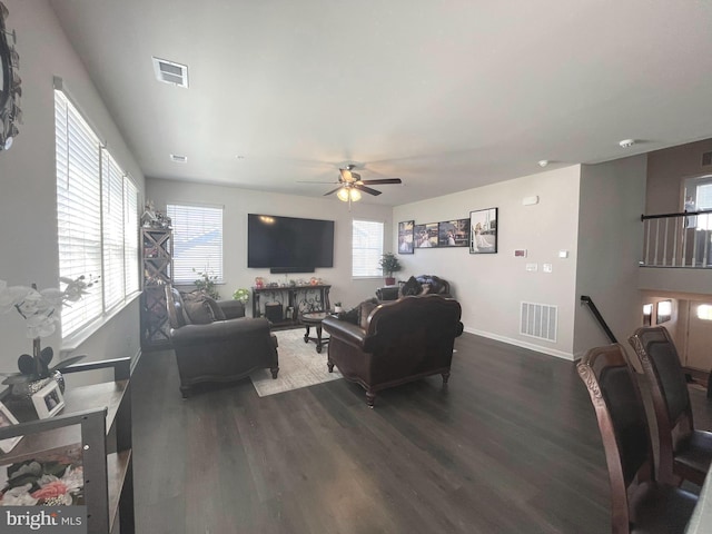 5740 Stone School Ln, Frederick, MD 21704 - living room with dark wood-style flooring, visible vents, baseboards, and a ceiling fan