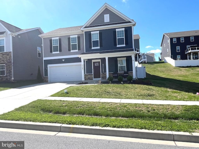 5740 Stone School Ln, Frederick, MD 21704 - view of front facade with a front yard, a porch, stone siding, a garage, and driveway