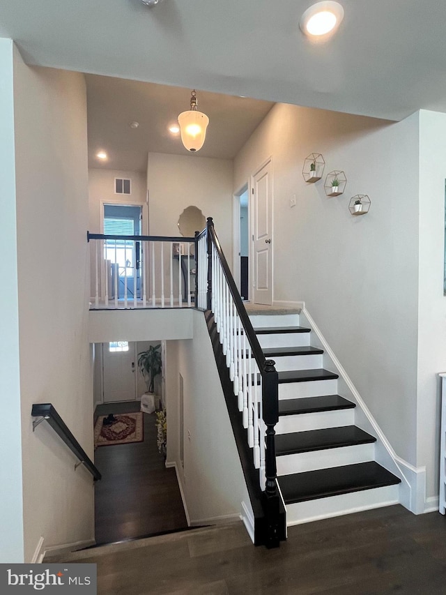 5740 Stone School Ln, Frederick, MD 21704 - staircase with visible vents, baseboards, a high ceiling, and wood finished floors