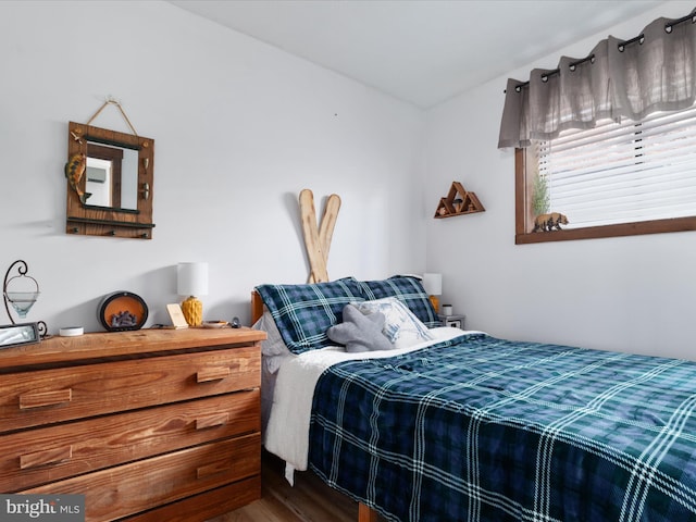bedroom with wood finished floors