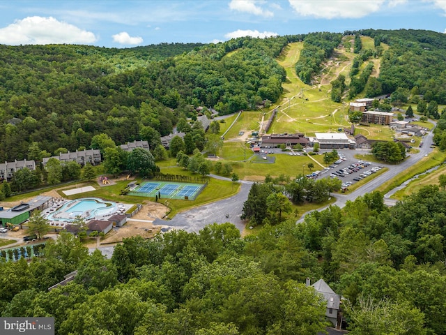 bird's eye view featuring a wooded view