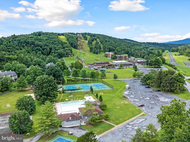 drone / aerial view featuring a forest view