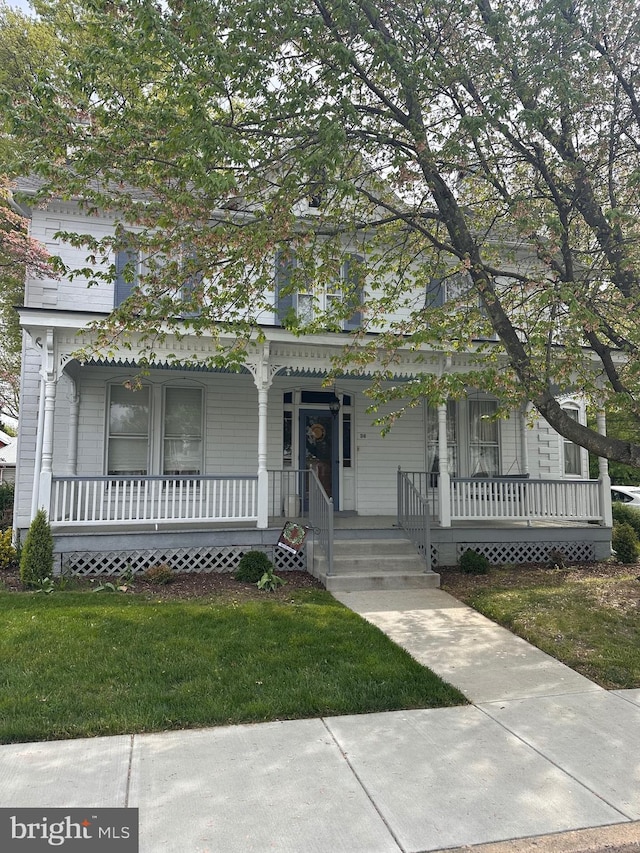 36 Fulton Ave, Walkersville, MD 21793 - view of front facade with covered porch and a front yard