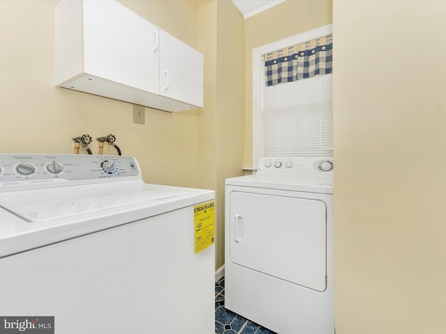 36 Fulton Ave, Walkersville, MD 21793 - washroom with washer and dryer, cabinet space, and dark tile patterned floors
