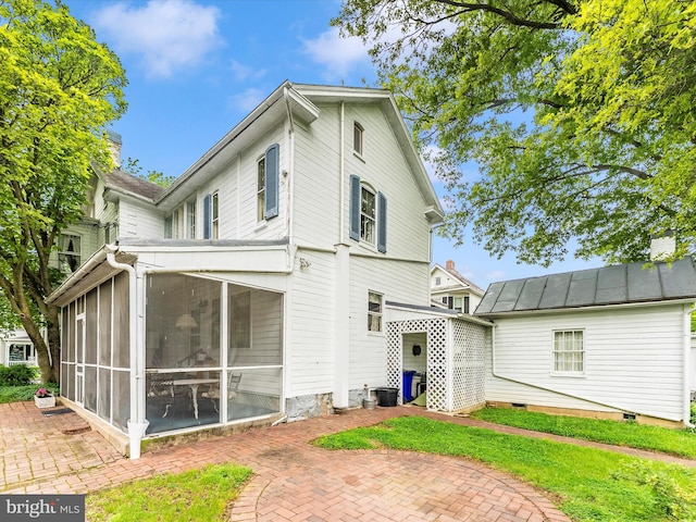36 Fulton Ave, Walkersville, MD 21793 - back of property featuring metal roof, a sunroom, a standing seam roof, and crawl space