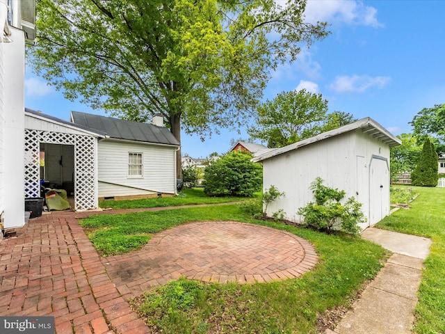 36 Fulton Ave, Walkersville, MD 21793 - view of yard featuring a patio, an outbuilding, and a shed